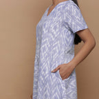 Left Detail of a Model wearing Handwoven Cotton Geometric Print Dress