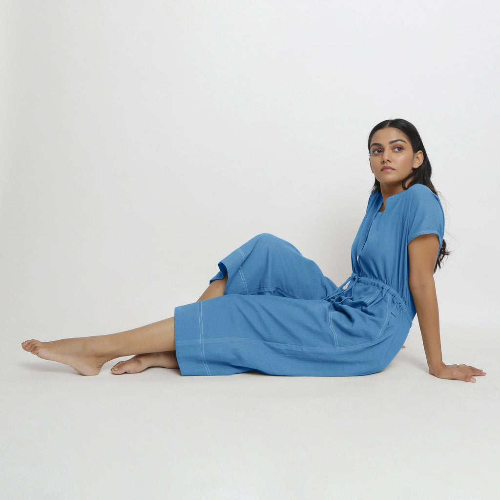 Front View of a Model wearing Powder Blue Vegetable Dyed Button-Down Jumpsuit