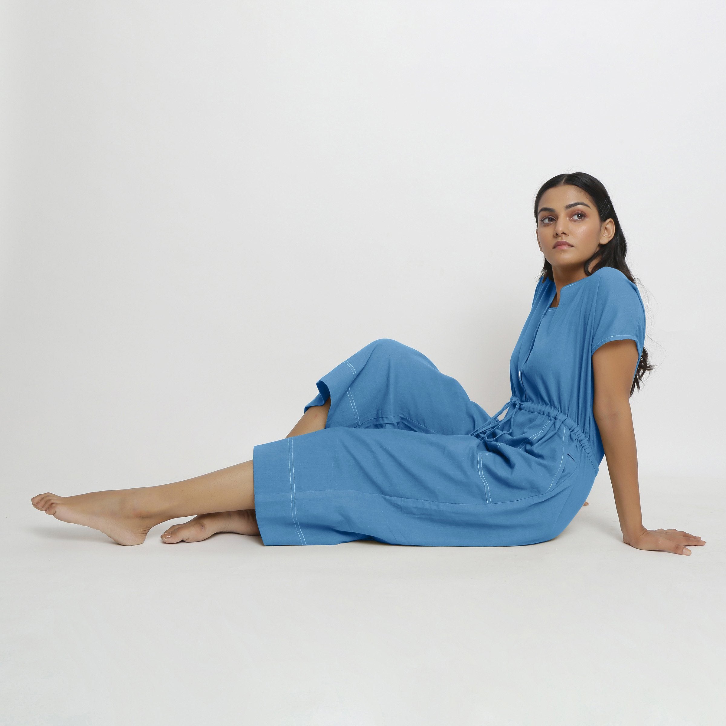 Front View of a Model wearing Powder Blue Vegetable Dyed Button-Down Jumpsuit