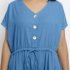 Front Detail of a Model wearing Powder Blue Vegetable Dyed Button-Down Jumpsuit