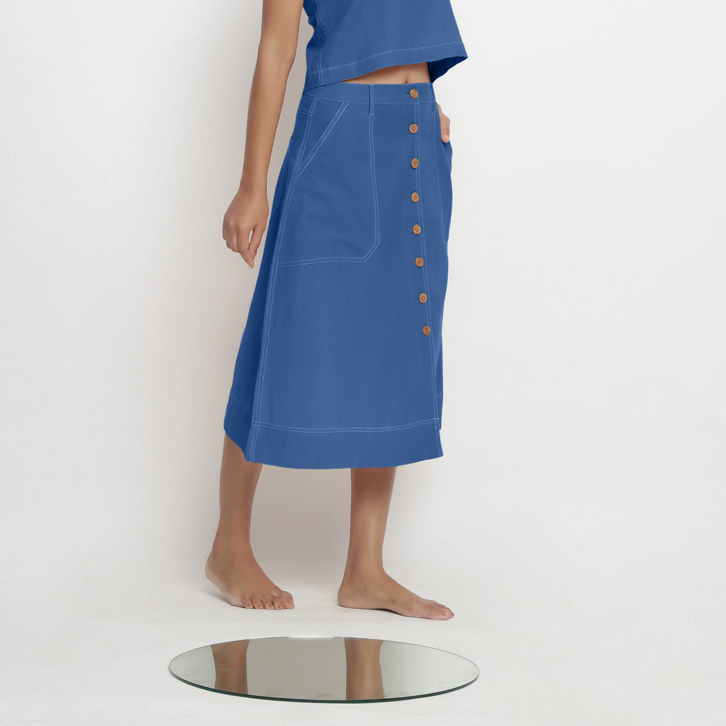 Right View of a Model wearing Powder Blue Vegetable Dyed Button-Down Skirt