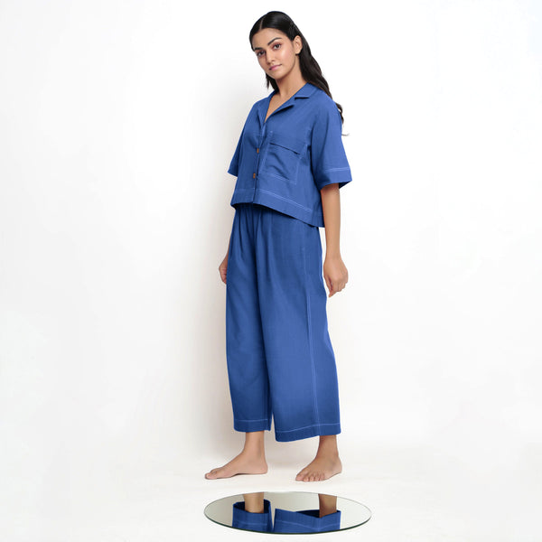 Left View of a Model wearing Powder Blue Vegetable Dyed Wide Legged Pant