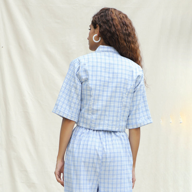 Back View of a Model wearing Powder Blue Checkered Handspun Cotton Short Jacket