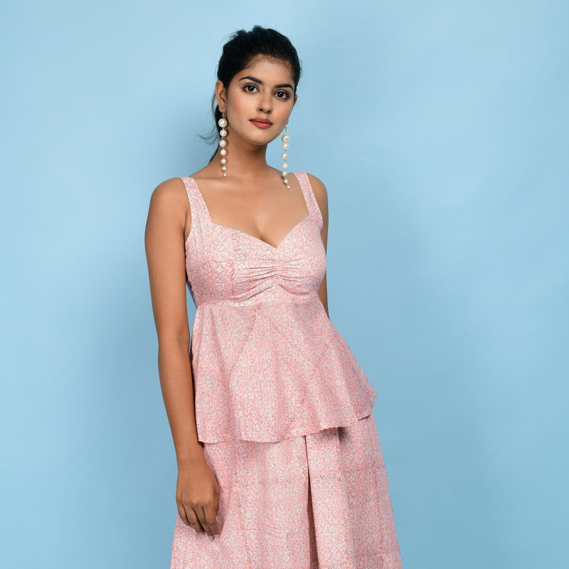 Front View of a Model wearing Powder Pink Block Printed Cotton Peplum Top