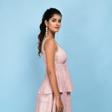 Right View of a Model wearing Powder Pink Block Printed Cotton Peplum Top
