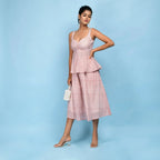Left View of a Model wearing Powder Pink Block Printed Cotton Peplum Top