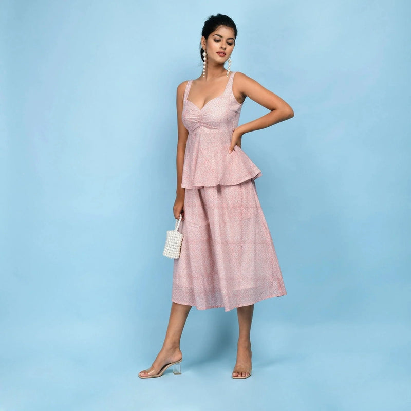 Left View of a Model wearing Powder Pink Block Printed Cotton Peplum Top