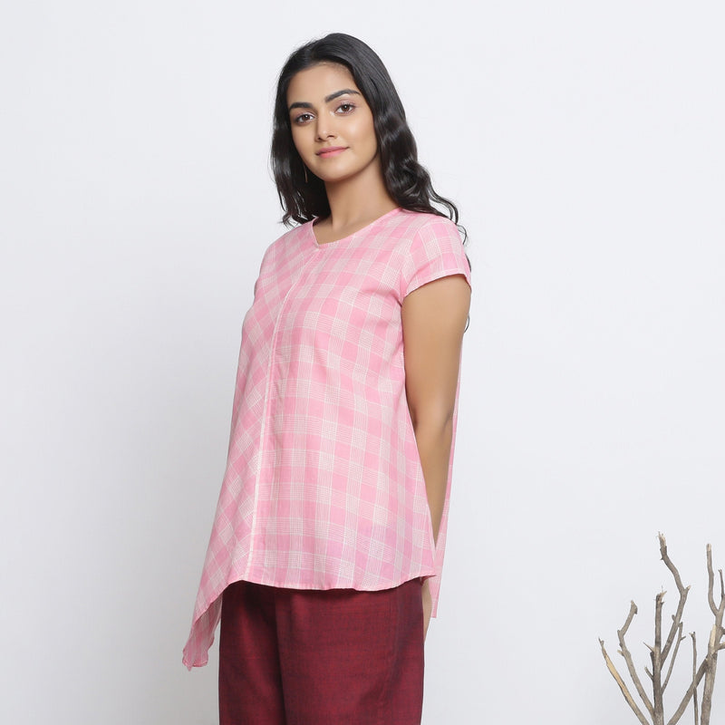 Left View of a Model wearing Powder Pink Checks Handspun Cotton Muslin Paneled Top