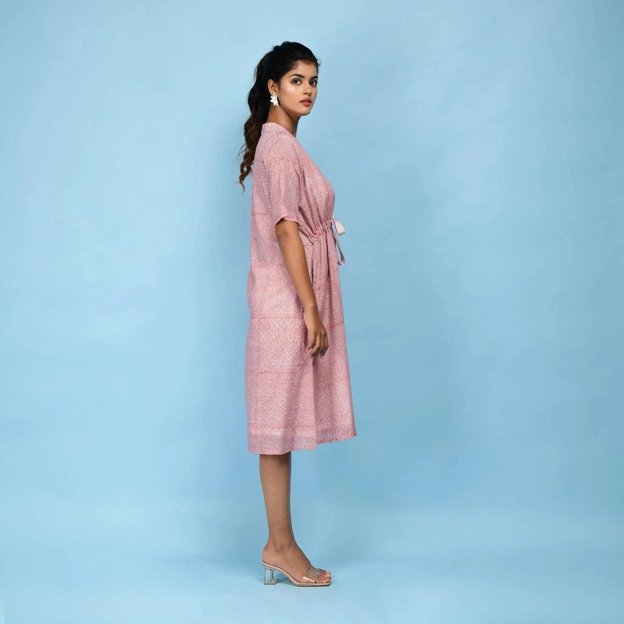 Right View of a Model wearing Powder Pink Cotton Block Print Knee-Length Kaftan Dress