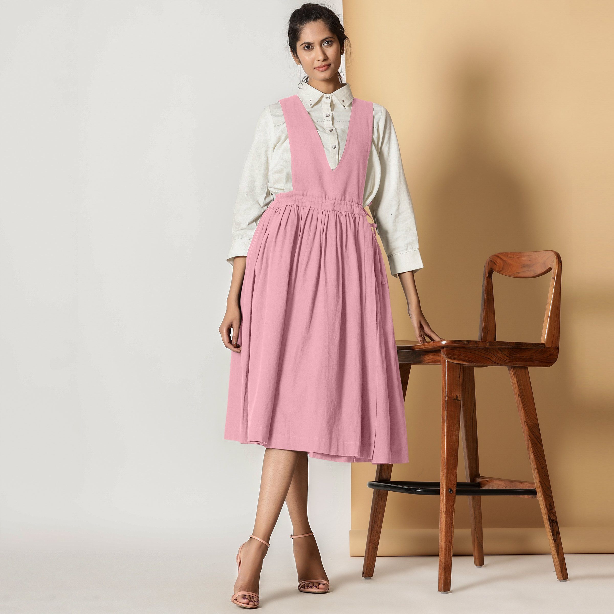 Front View of a Model wearing Powder Pink Cotton Flax Pinafore Midi Wrap Dress