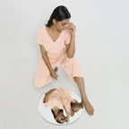 Front View of a Model wearing Powder Pink Vegetable Dyed Button-Down Jumpsuit