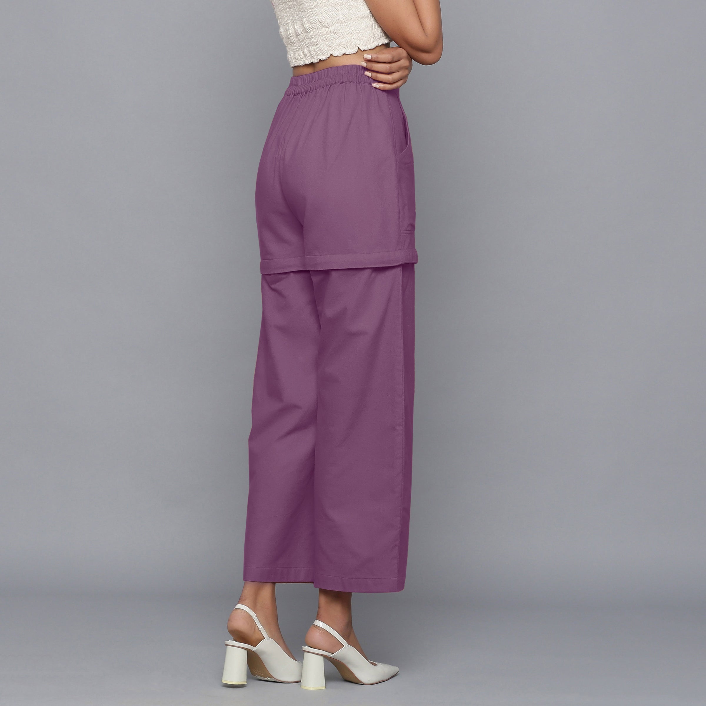 Right View of a Model wearing Purple Flannel Convertible Pant Shorts