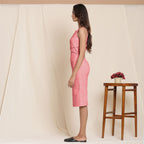 Left View of a Model wearing Red Knee Length Cotton Sheath Dress