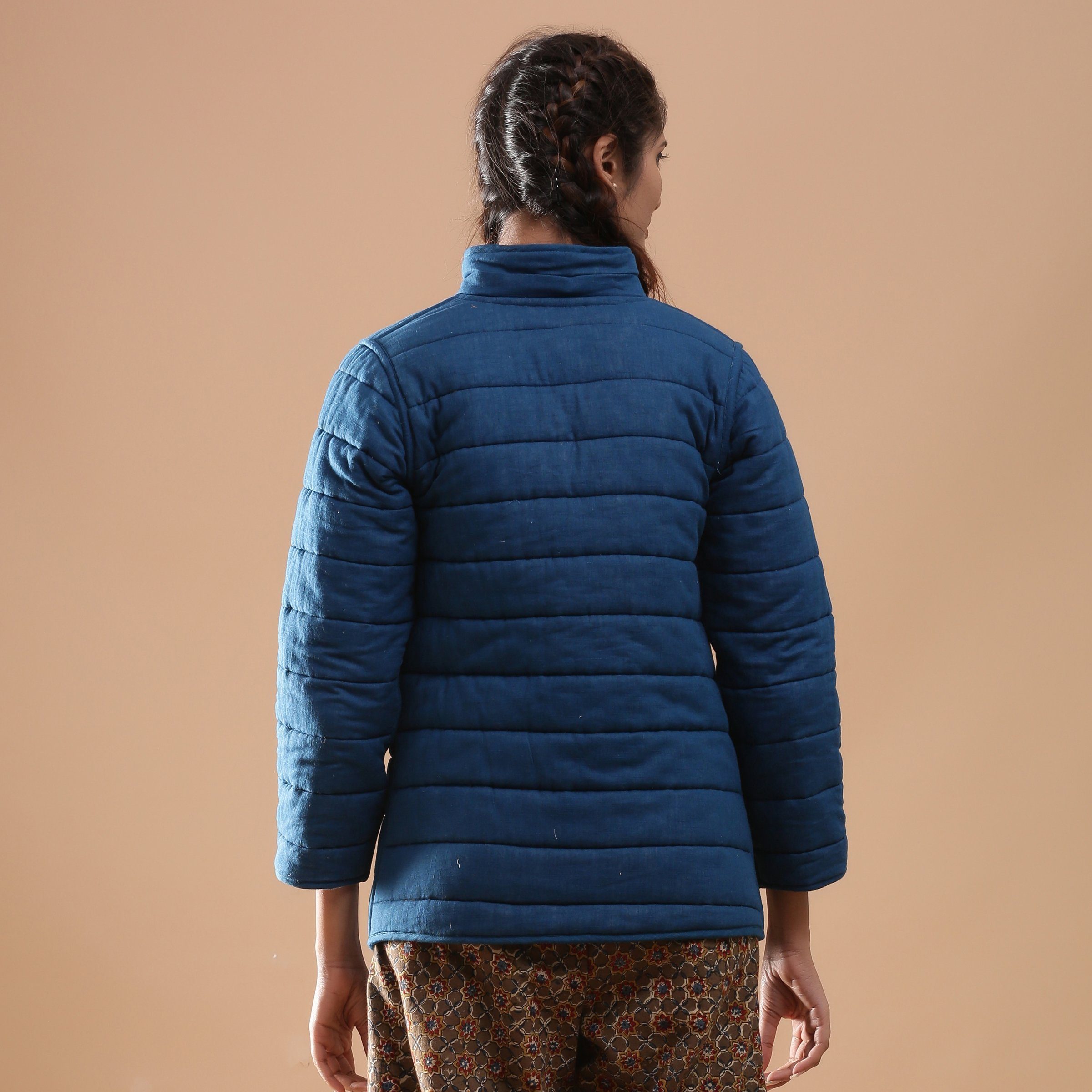Back View of a Model wearing Blue Reversible Detachable Quilted Cotton Hoodie Jacket