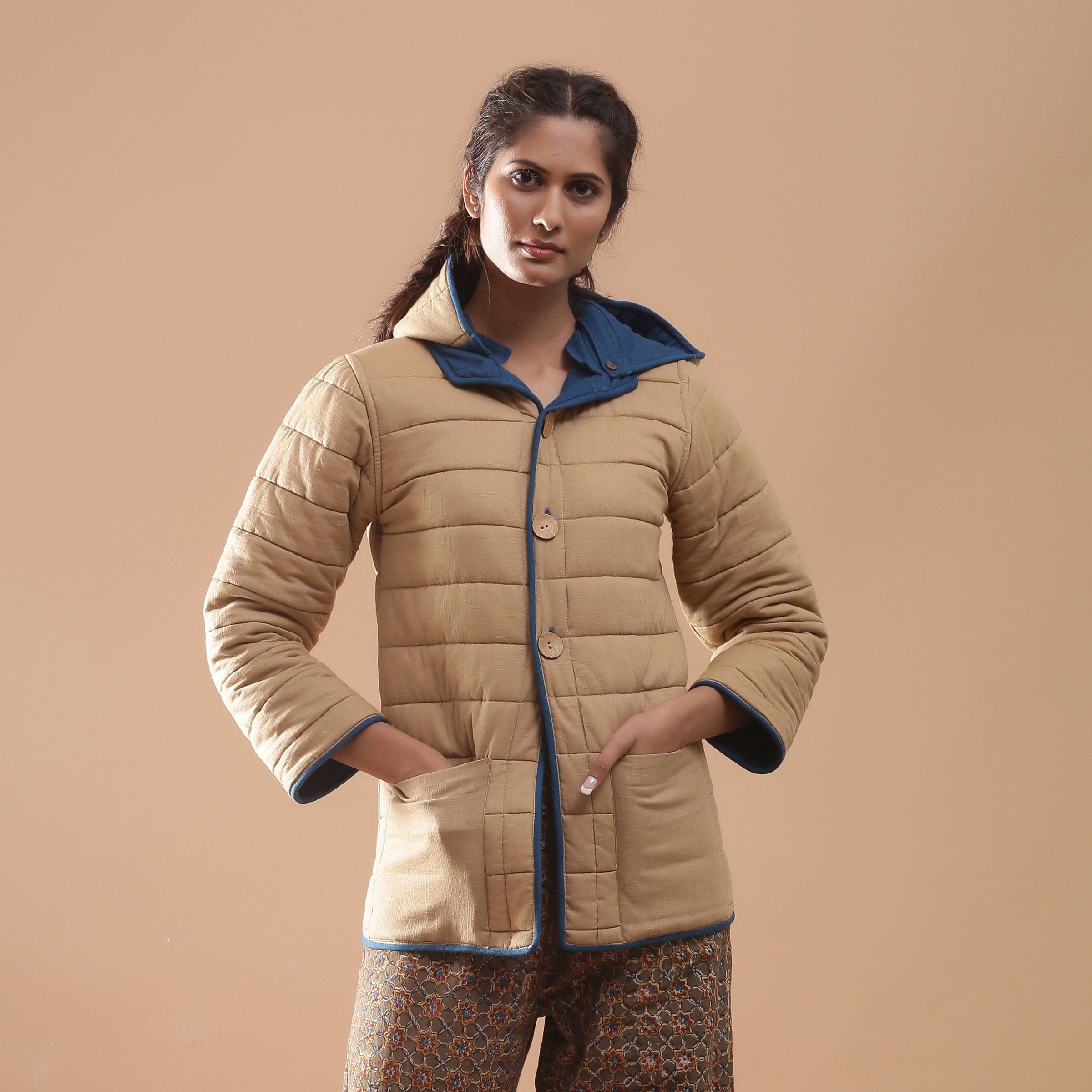 Front View of a Model wearing Blue Reversible Detachable Quilted Cotton Hoodie Jacket