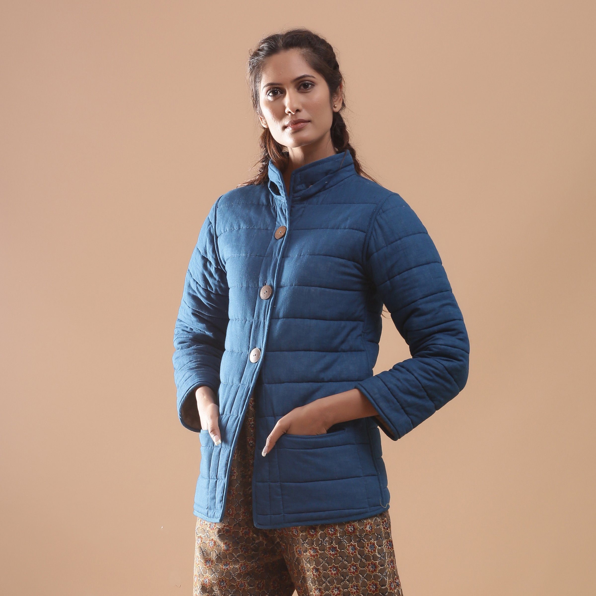 Front View of a Model wearing Blue Reversible Detachable Quilted Cotton Hoodie Jacket