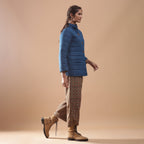 Right View of a Model wearing Blue Reversible Detachable Quilted Cotton Hoodie Jacket
