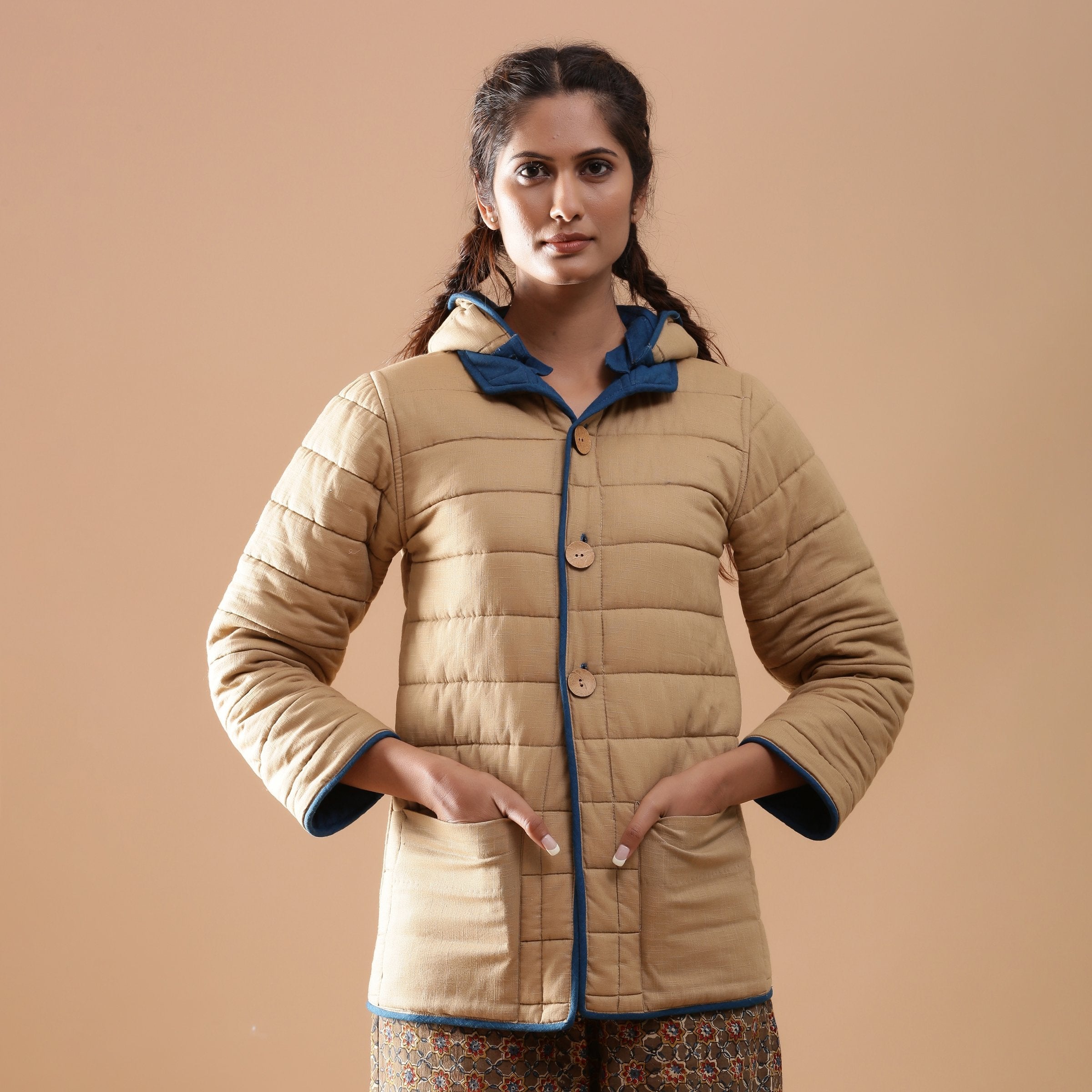 Front View of a Model wearing Blue Reversible Detachable Quilted Cotton Hoodie Jacket