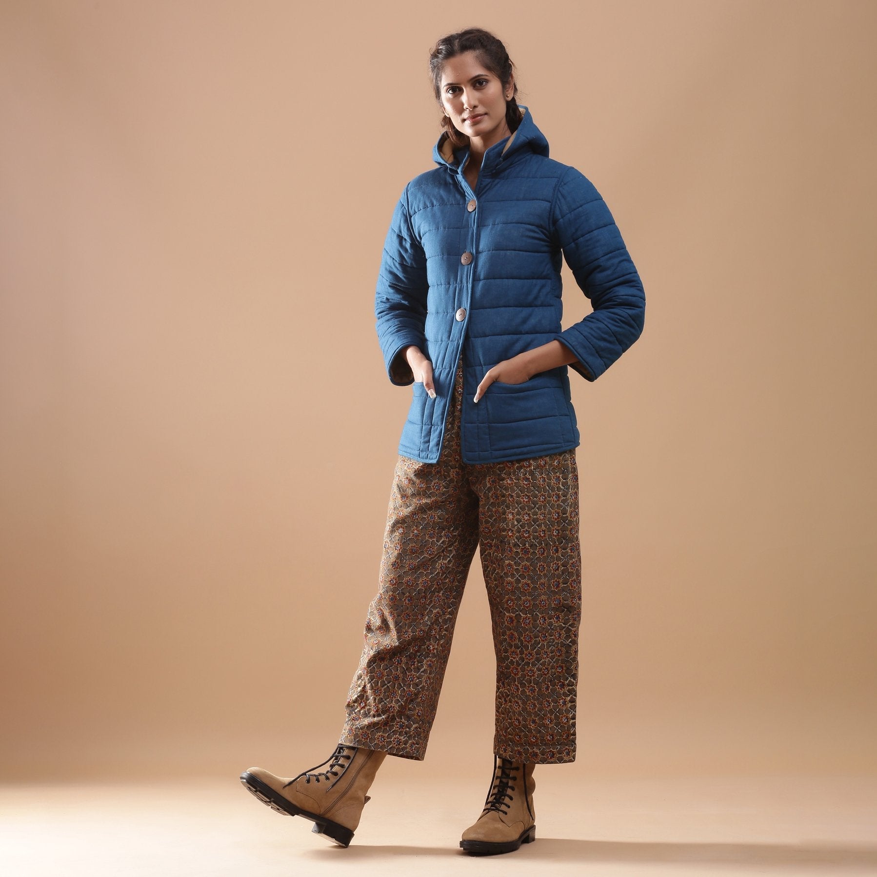 Left View of a Model wearing Blue Reversible Detachable Quilted Cotton Hoodie Jacket
