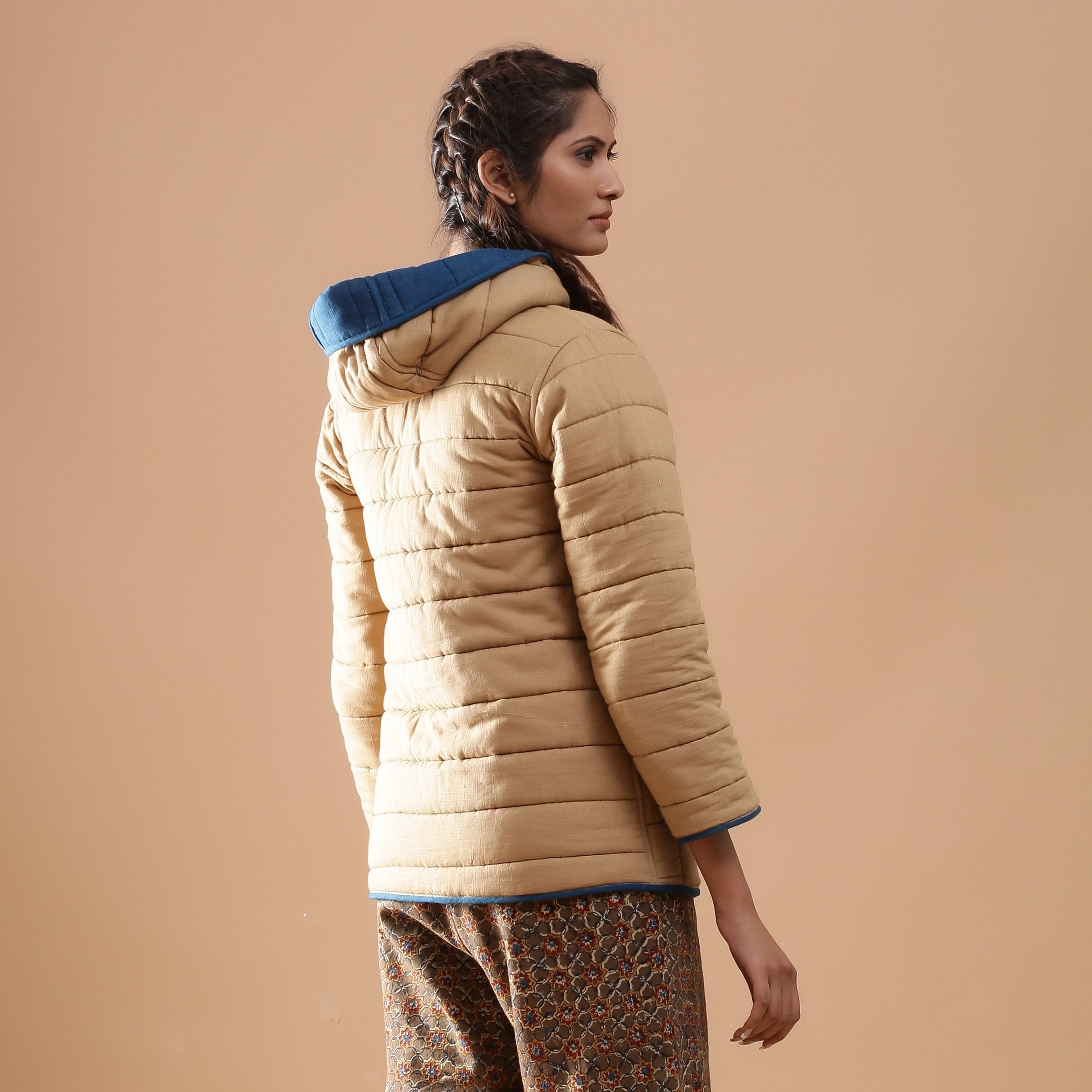 Back View of a Model wearing Blue Reversible Detachable Quilted Cotton Hoodie Jacket
