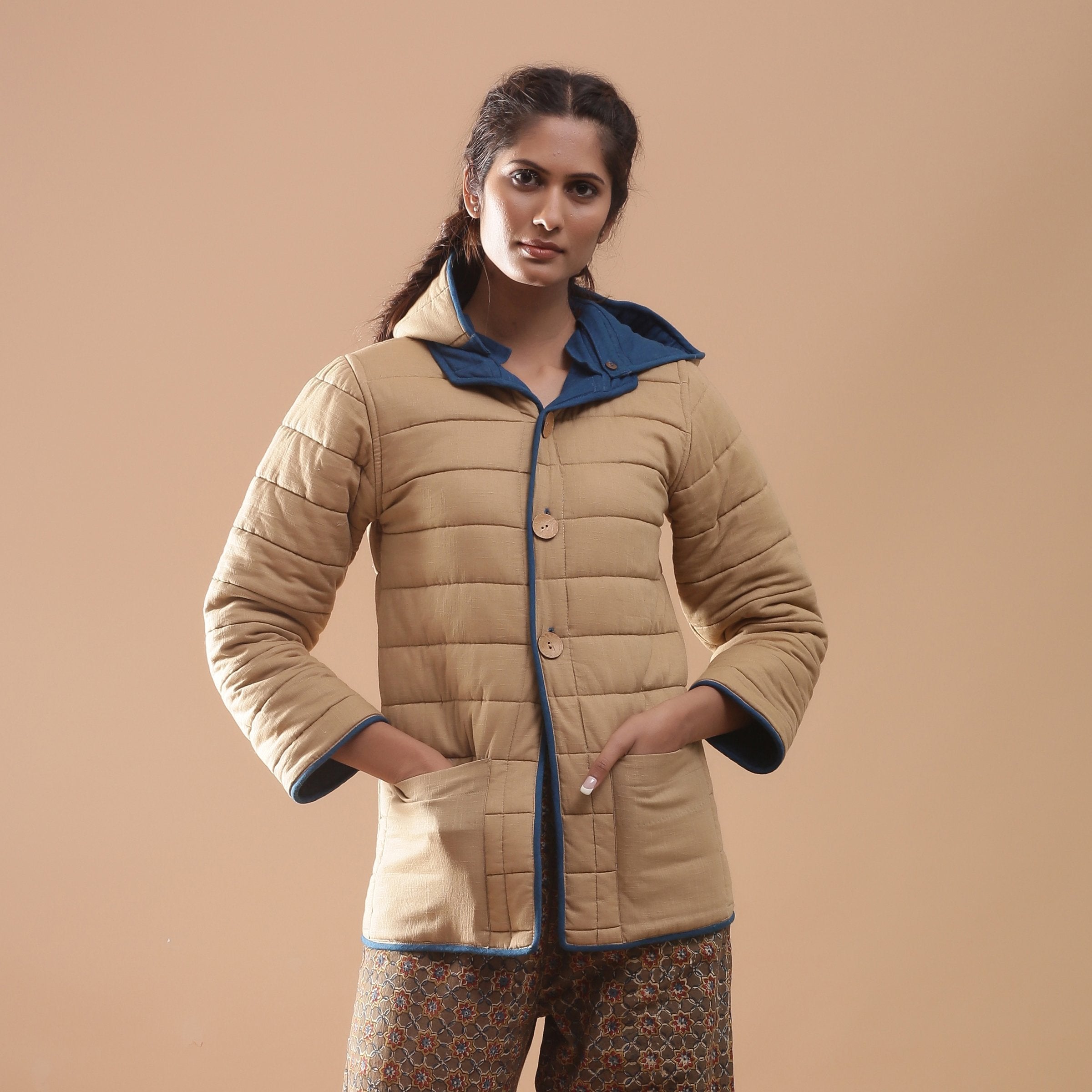 Front View of a Model wearing Blue Reversible Detachable Quilted Cotton Hoodie Jacket