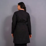 Back View of a Model wearing Reversible English Rose and Black Warm Cotton Flannel Front Open Overlay Coat