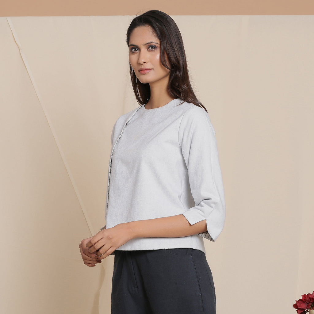Left View of a Model wearing Reversible Grey Warm Cotton Button-Down Short Top