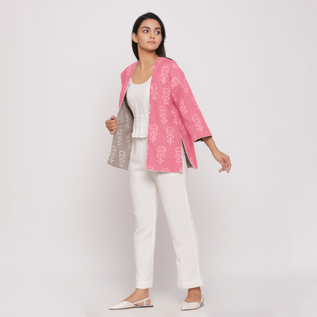 Left View of a Model wearing Reversible Warm Block Printed Pink Short Cotton Overlay
