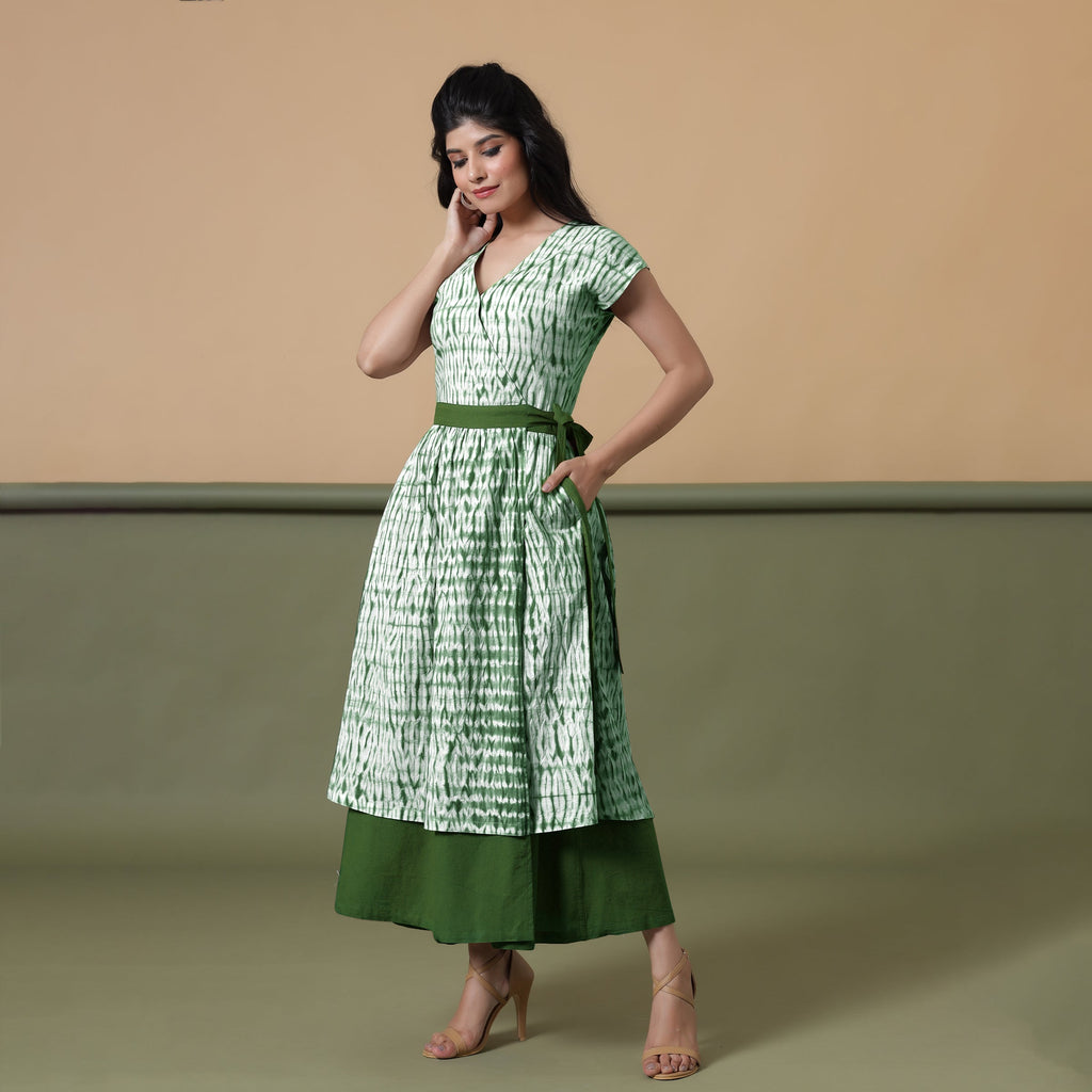 Left View of a Model wearing Reversible Forest Green Tie-Dye Cotton Maxi Wrap Dress
