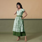 Left View of a Model wearing Reversible Forest Green Tie-Dye Cotton Maxi Wrap Dress
