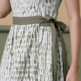 Front Detail of a Model wearing Reversible Shibori Green Wrap Dress