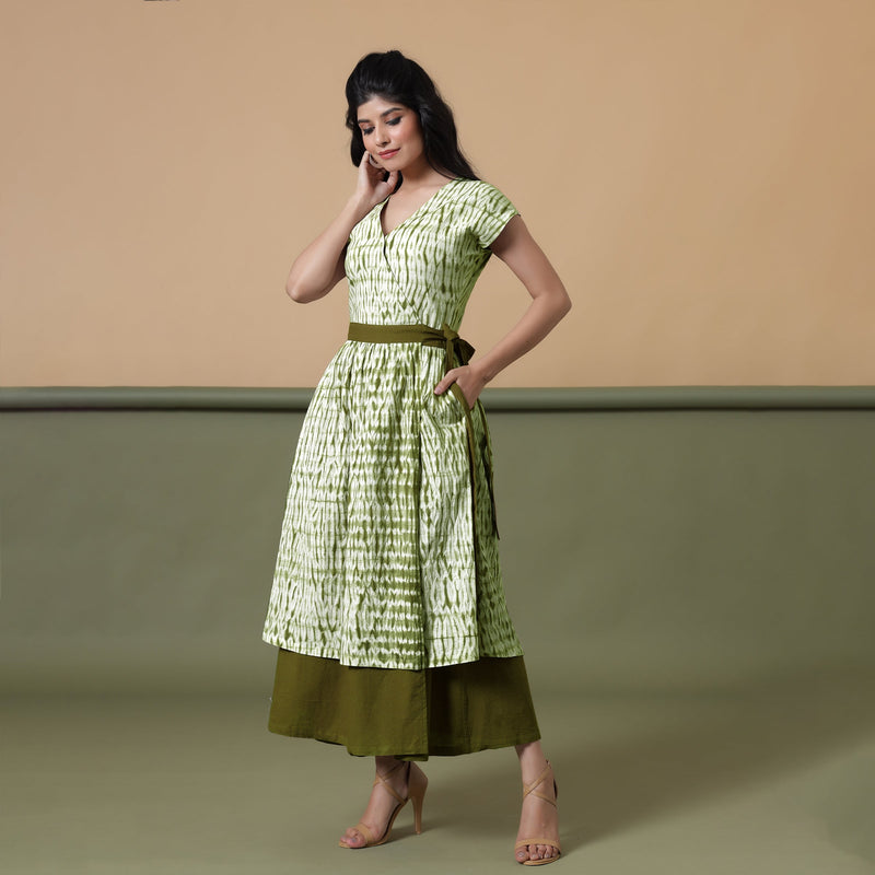 Left View of a Model wearing Reversible Moss Green Tie-Dye Cotton Maxi Wrap Dress