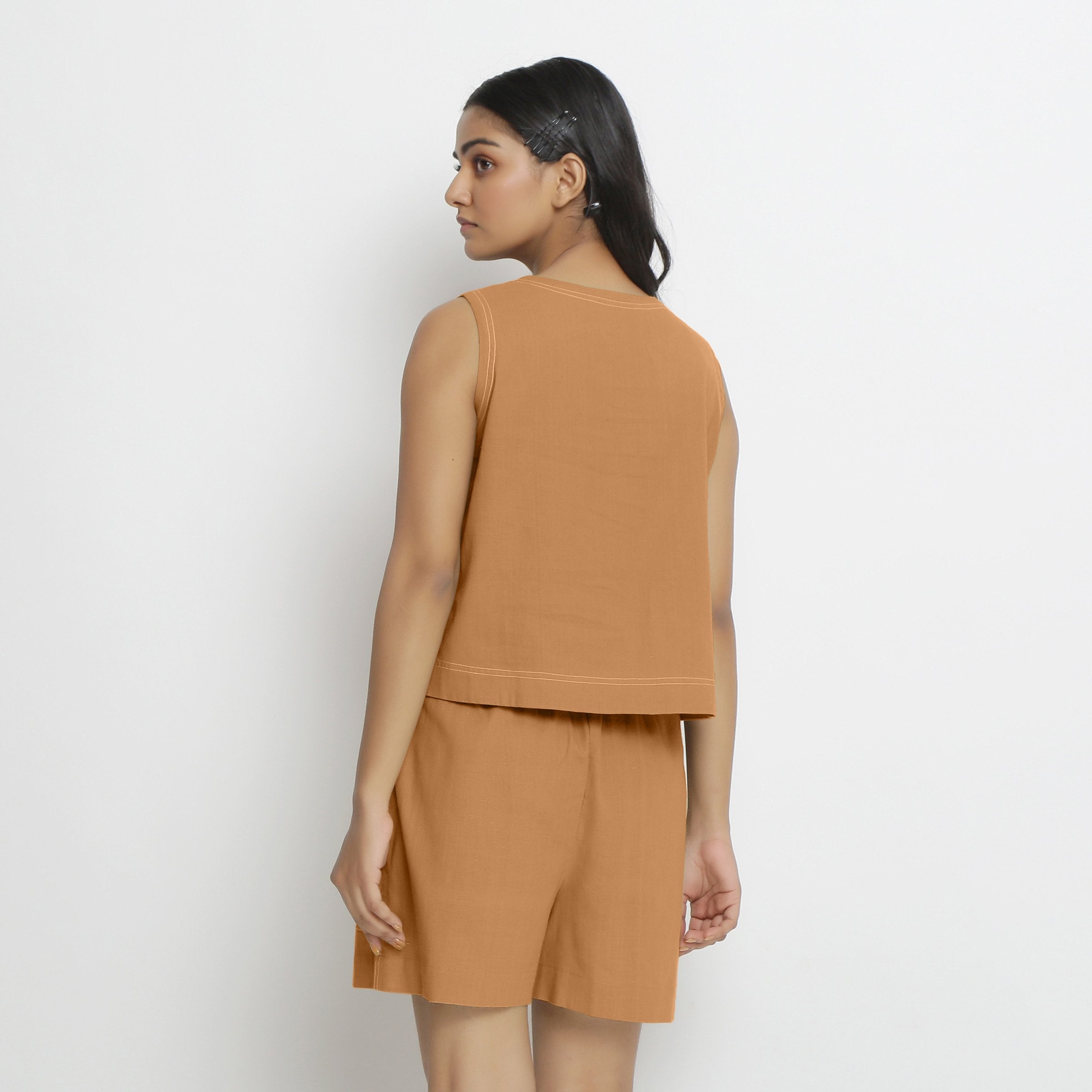 Back View of a Model wearing Rust Handspun Vegetable Dyed Crop Top