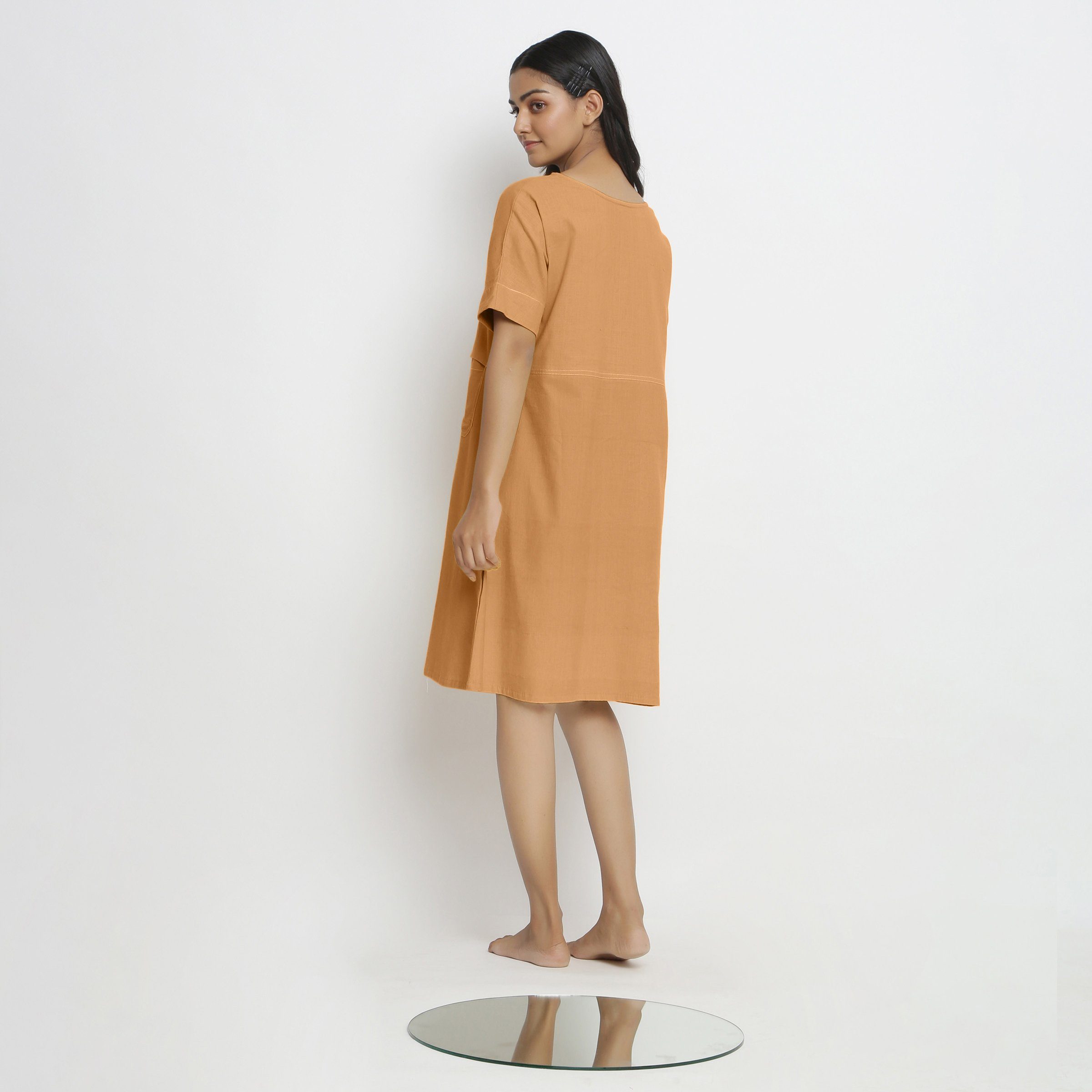 Back View of a Model wearing Rust Handspun Vegetable Dyed Yoked Dress