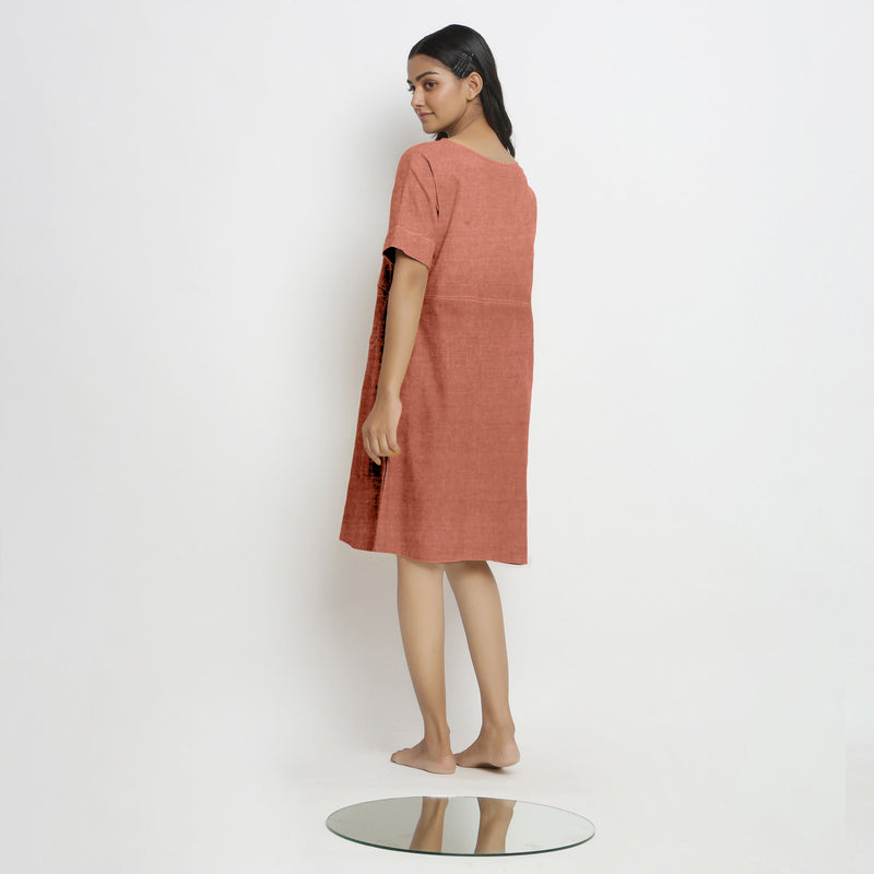 Back View of a Model wearing Rust 100% Linen Yoked Knee Length Shift Dress