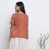 Back View of a Model wearing Rust Sandstone Round Neck Linen Gathered Top