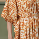 Close View of a Model wearing Rust Sandstone Shibori Tie-Dye Cotton Midi Kaftan Dress