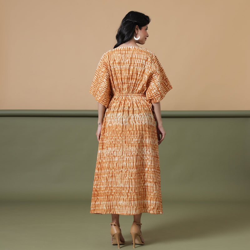 Back View of a Model wearing Rust Sandstone Shibori Tie-Dye Cotton Midi Kaftan Dress