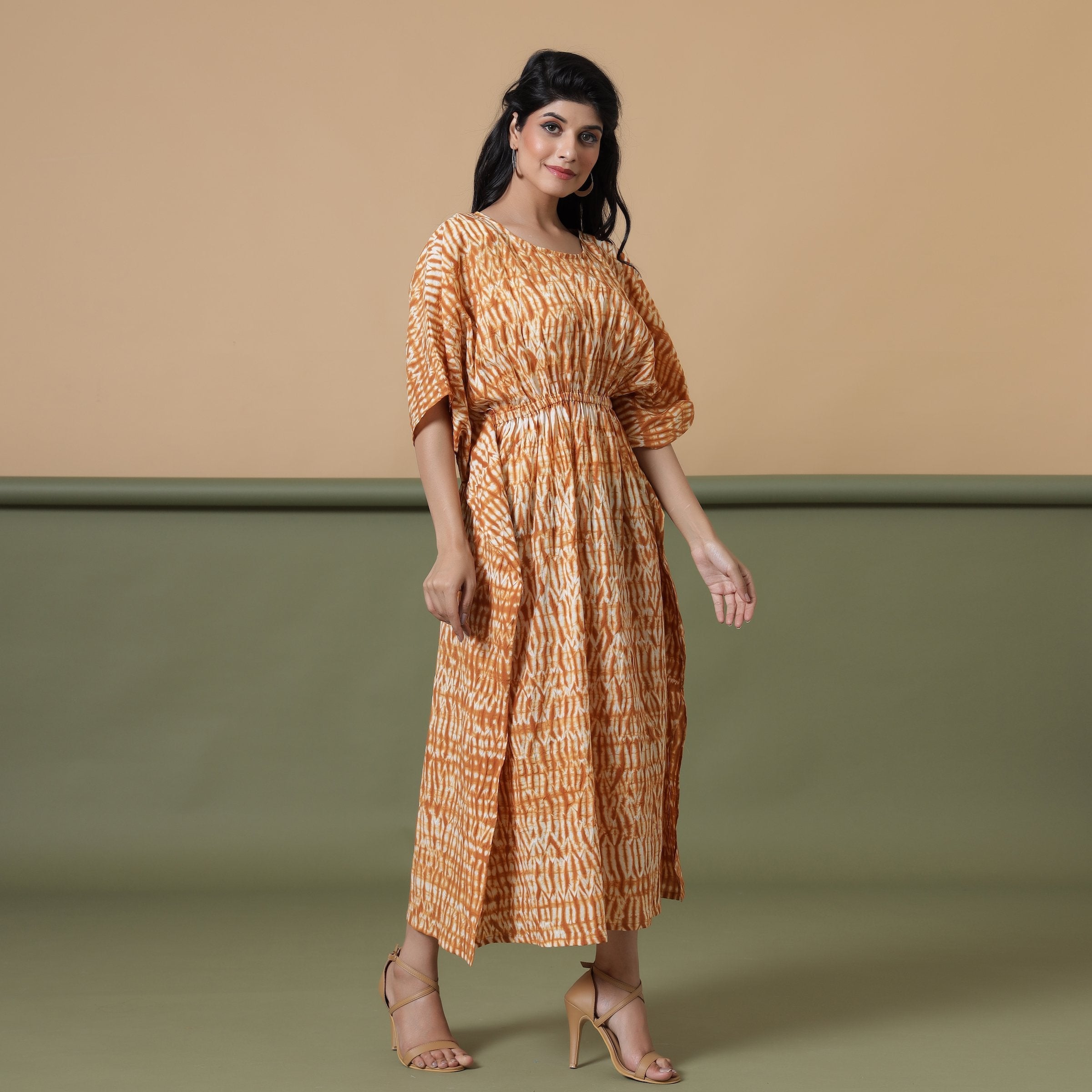 Right View of a Model wearing Rust Sandstone Shibori Tie-Dye Cotton Midi Kaftan Dress