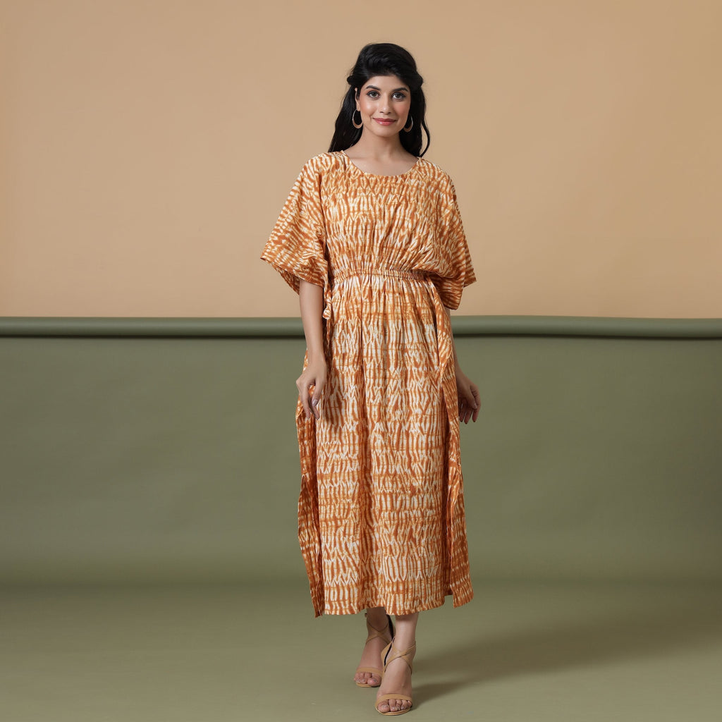 Front View of a Model wearing Rust Sandstone Shibori Tie-Dye Cotton Midi Kaftan Dress