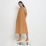 Left View of a Model wearing Rust Vegetable Dyed A-Line Paneled Dress
