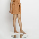 Right View of a Model wearing Rust Vegetable Dyed Handspun Short Shorts