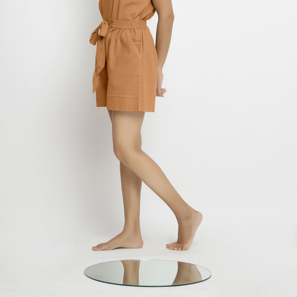 Left View of a Model wearing Rust Vegetable Dyed Handspun Short Shorts