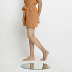 Left View of a Model wearing Rust Vegetable Dyed Handspun Short Shorts