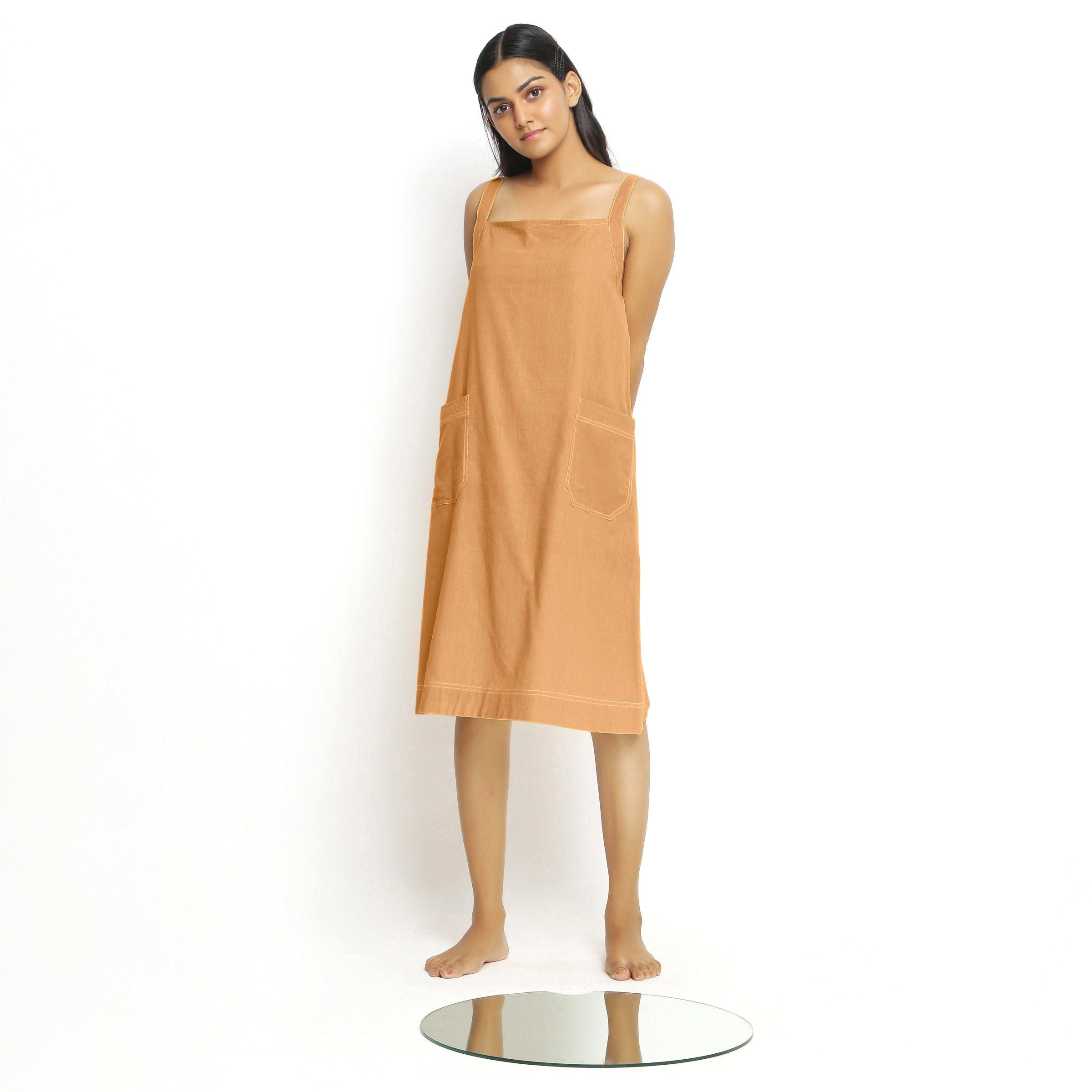 Front View of a Model wearing Rust Vegetable Dyed Handspun Slip Dress
