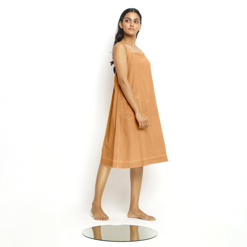 Right View of a Model wearing Rust Vegetable Dyed Handspun Slip Dress