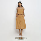 Front View of a Model wearing Rustic Vegetable Dyed Cotton Button-Down Midi Skirt