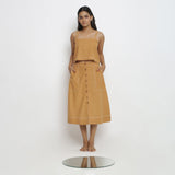 Front View of a Model wearing Rustic Vegetable Dyed Cotton Button-Down Midi Skirt