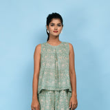 Front View of a Model wearing Sage Green Block Printed Pleated Cotton Top