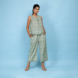 Front View of a Model wearing Sage Green Block Printed Pleated Cotton Top